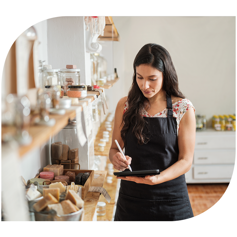 A woman taking inventory in a home fragrance shop