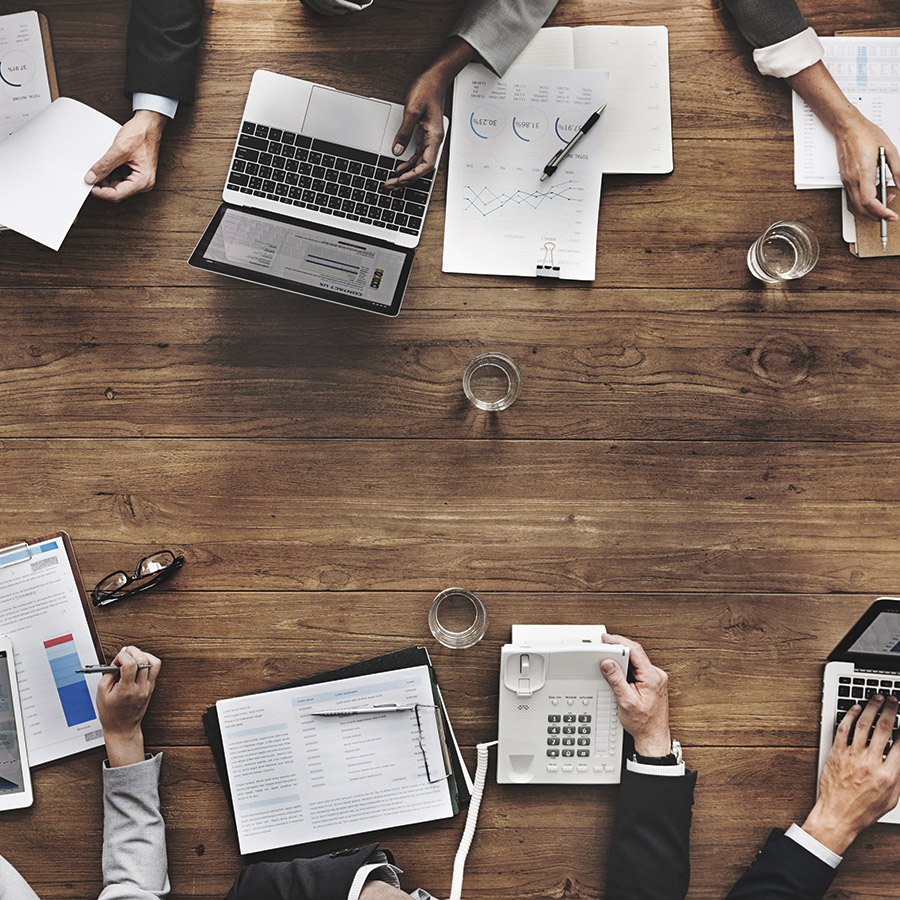 Arial view of poeple sitting at a conference table